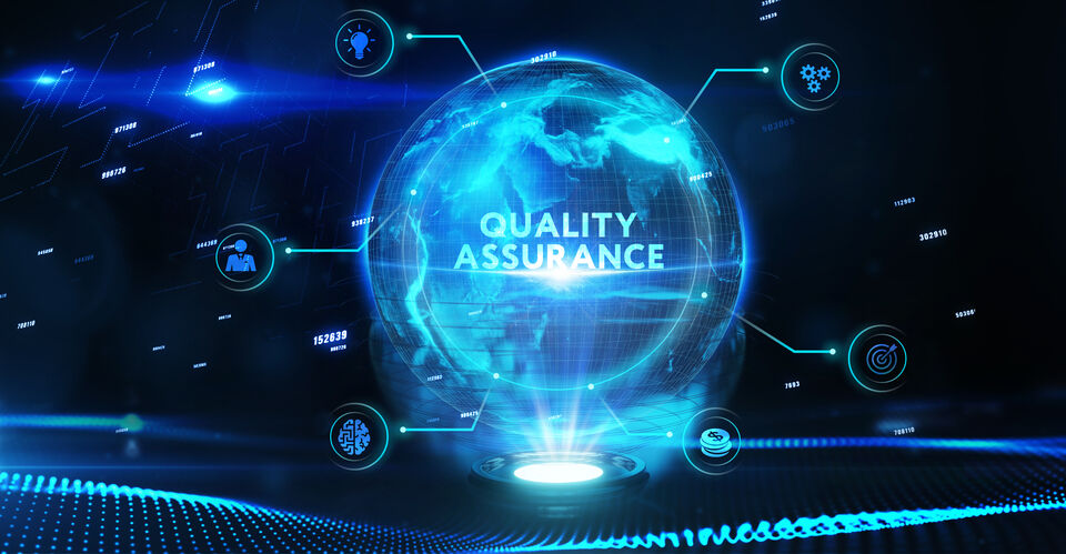 A blue illuminated globe with the words "Quality Assurance" on it