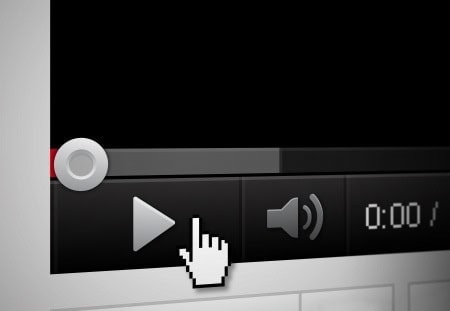 Close-up of a video player interface showing the play button, volume control, and progress bar, with a hand cursor hovering over the play button.